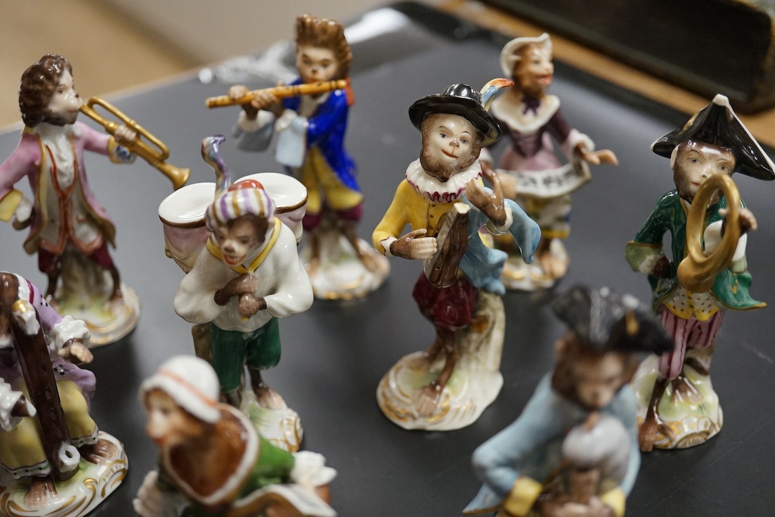 A group of twenty German porcelain monkey band figures, largest 15.5cm high
